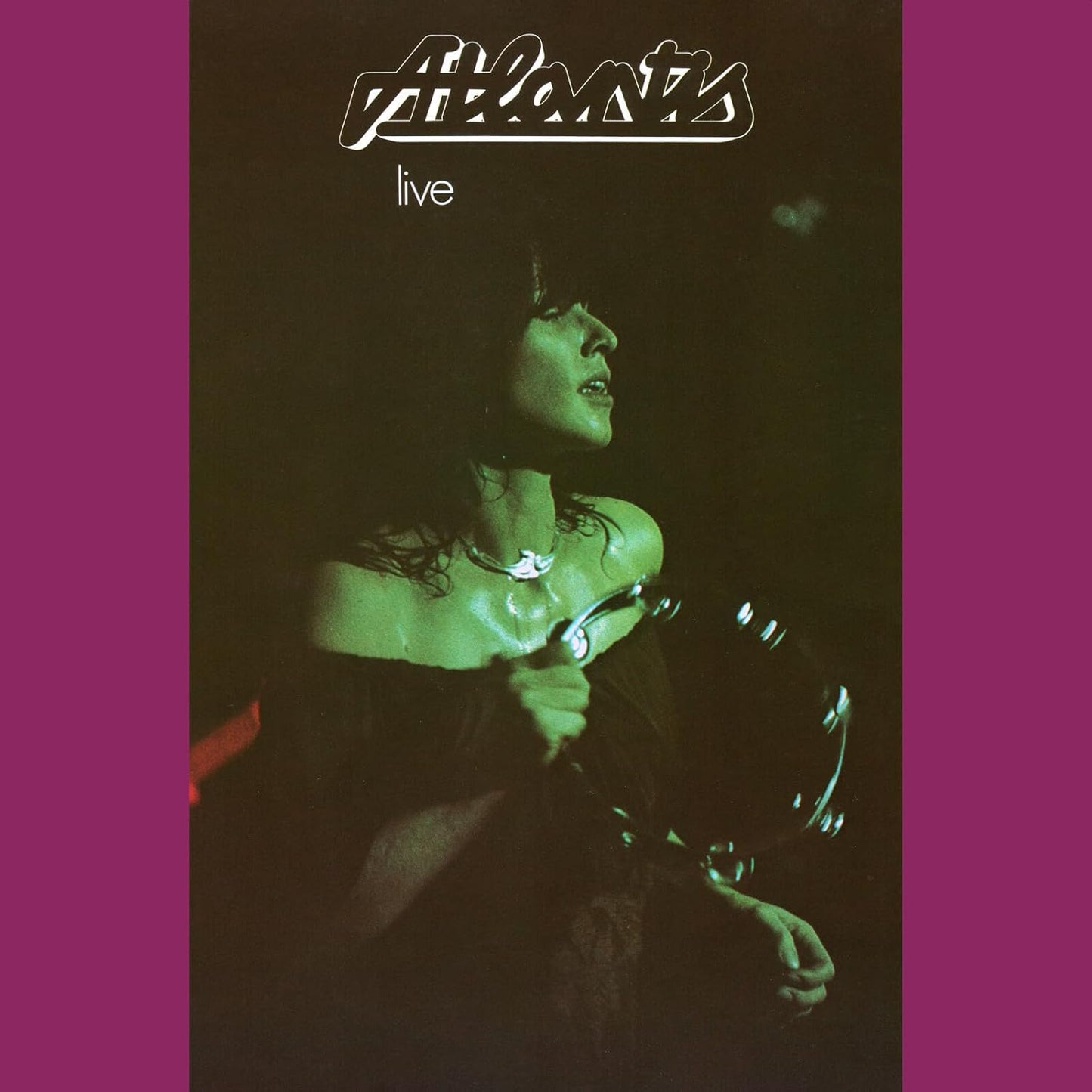 CD cover for “Atlantis - Live” featuring a singer with a microphone.
