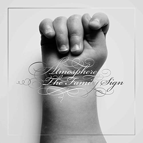 Black and white album cover featuring a hand with clasped fingers.