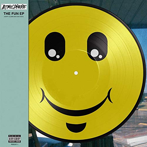 Yellow vinyl record with a large, black-outlined smiley face design.