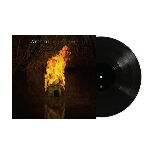 Atreyu vinyl record with album art featuring a burning figure in water.