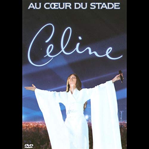 Celine Dion concert DVD cover, singer with arms raised on stage.