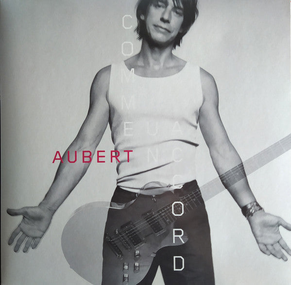 Album cover featuring Jean-Louis Aubert with a guitar, text vertically aligned.