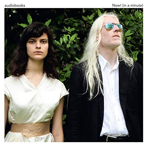 Vinyl album cover featuring two people with contrasting hair and expressions.