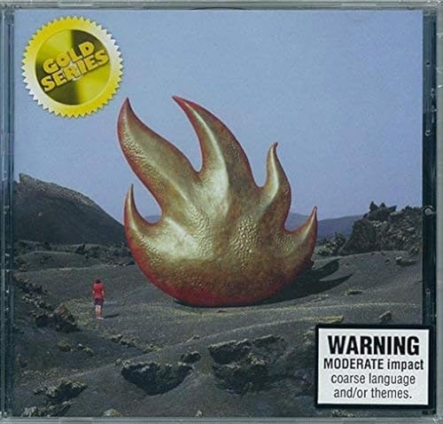 Audioslave CD cover: gold flame sculpture against a mountainous landscape.
