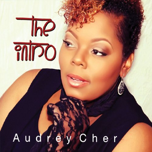 "Album cover featuring a woman with short curly hair and black top."