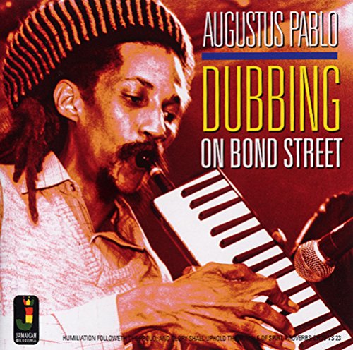 Album cover with a man playing a keyboard and harmonica.