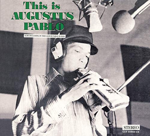 Augustus Pablo playing a melodica in a recording studio, album cover.