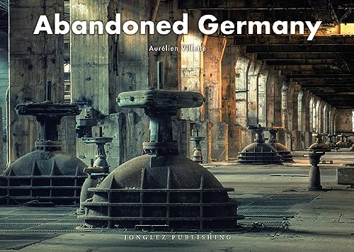 Book cover showing large, rusted industrial machinery inside a vast, abandoned concrete hall.