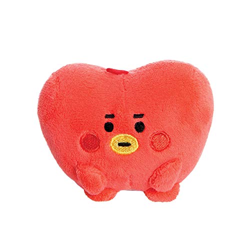 The image depicts a red, heart-shaped plush toy with a cartoonish face. Here is a concise alt text: "Red heart-shaped soft toy with embroidered face and small legs."