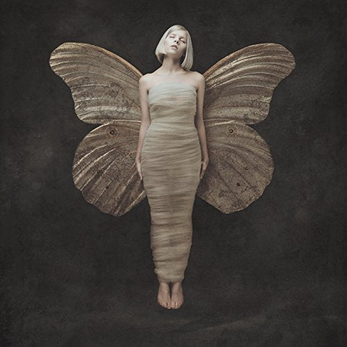 Woman with large moth wings, pale skin, and draped fabric clothing.