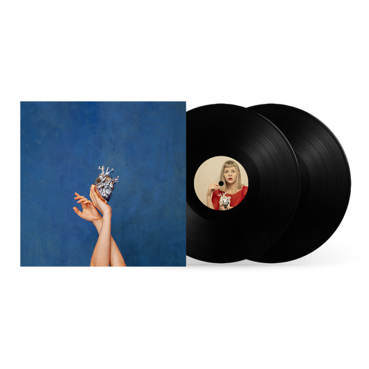 AURORA vinyl record with album art featuring hands holding a metallic heart.