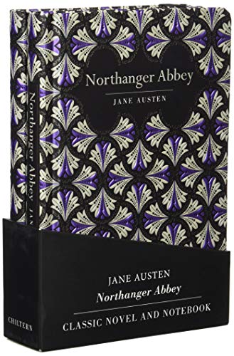 Hardcover book and notebook in a black box with purple and white patterns.