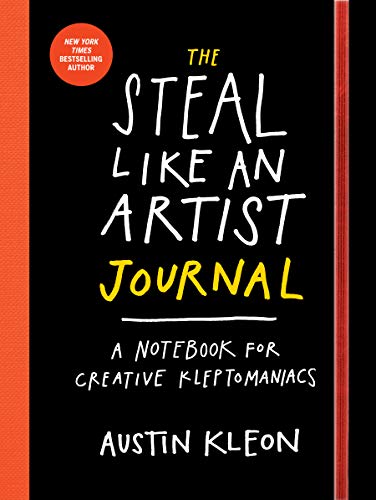 Black journal cover with white and yellow hand-drawn text and orange spine accents.