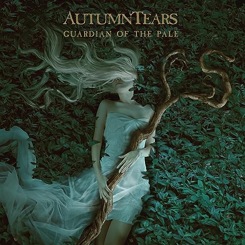 Album cover: woman with flowing hair amidst leaves and a tree branch.