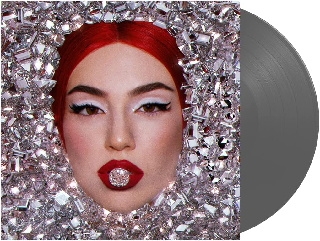 Vinyl record sleeve featuring a woman's face surrounded by silver jewels.