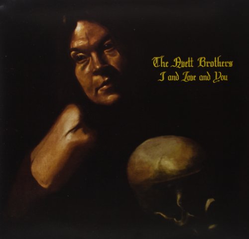 Avett Brothers album cover: portrait with skull, dark background.
