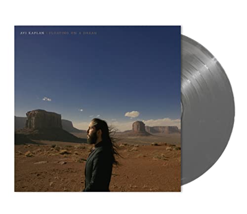 Vinyl record of "Floating On A Dream" with desert landscape cover art.