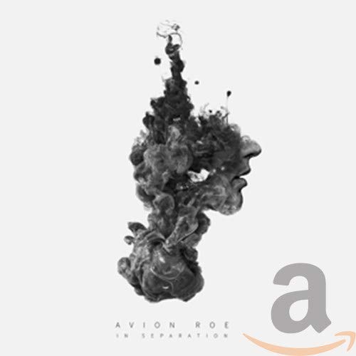 Black and white abstract image of a face formed from ink splashes.