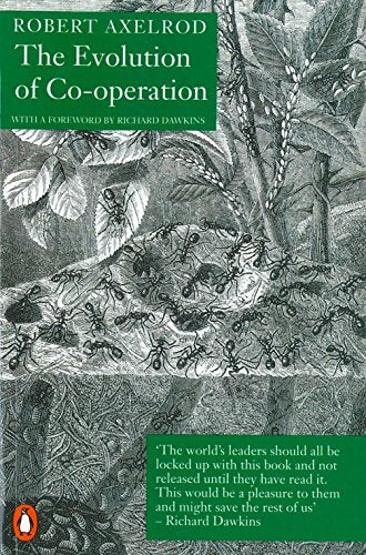 Book cover: "The Evolution of Co-operation" with ants and foliage illustration.