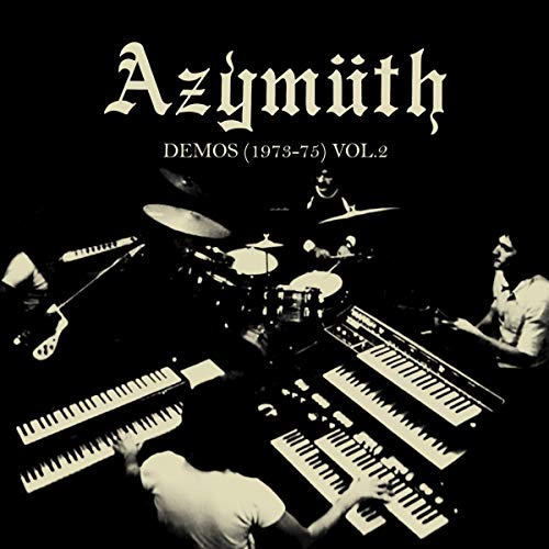 Black and white album cover featuring musicians with keyboards and drums.