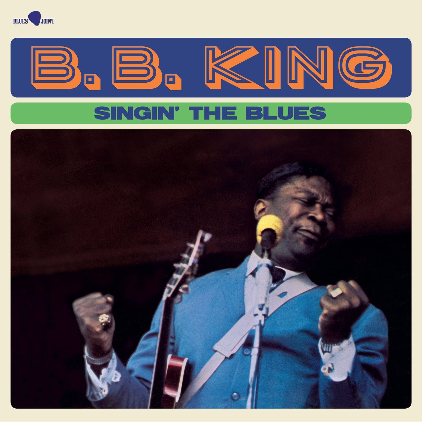 Album cover featuring B.B. King singing into a microphone with his guitar.