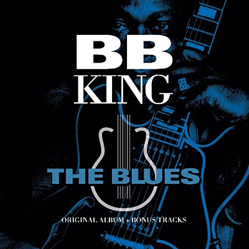 B.B. King's album cover featuring a man holding a guitar against a black background.