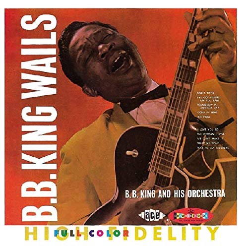B.B. King album cover with man playing guitar, red background, white border.