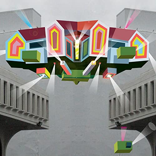 Abstract colorful geometric structure floating between two grey concrete balconies with spotlights.