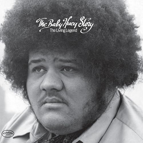Black and white portrait of Baby Huey with large afro, album cover.