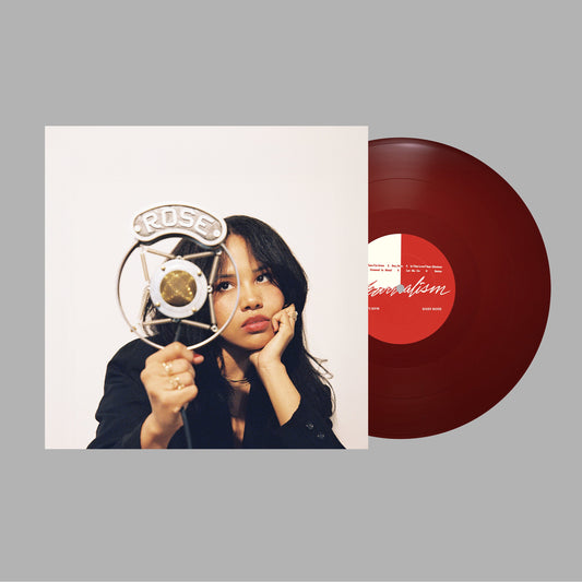 Maroon vinyl LP of Baby Rose's "YEARNALISM" album, with label visible.
