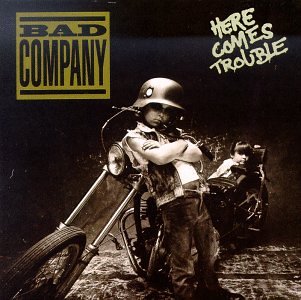 Bad Company album cover: child with motorcycle and helmet.