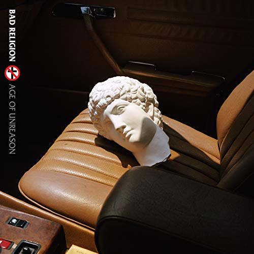 Album cover: a white bust in a vintage car's leather seat.