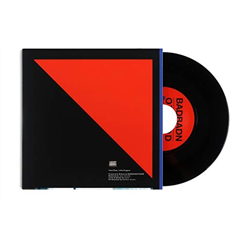 Vinyl record in sleeve with red and black diagonal design.