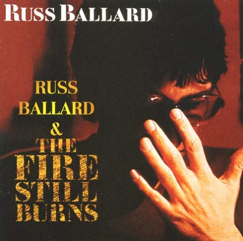CD cover for Russ Ballard’s “The Fire Still Burns,” featuring a portrait.