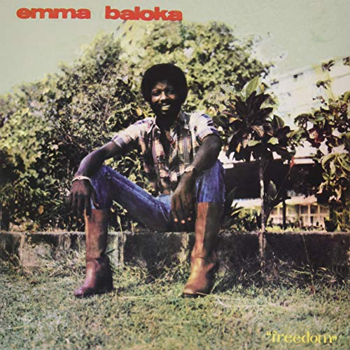 Album cover featuring a smiling man in jeans and boots outdoors.