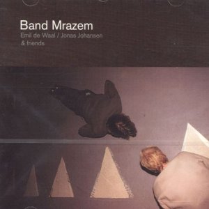 CD cover showing two people lying on a floor near triangular shapes.