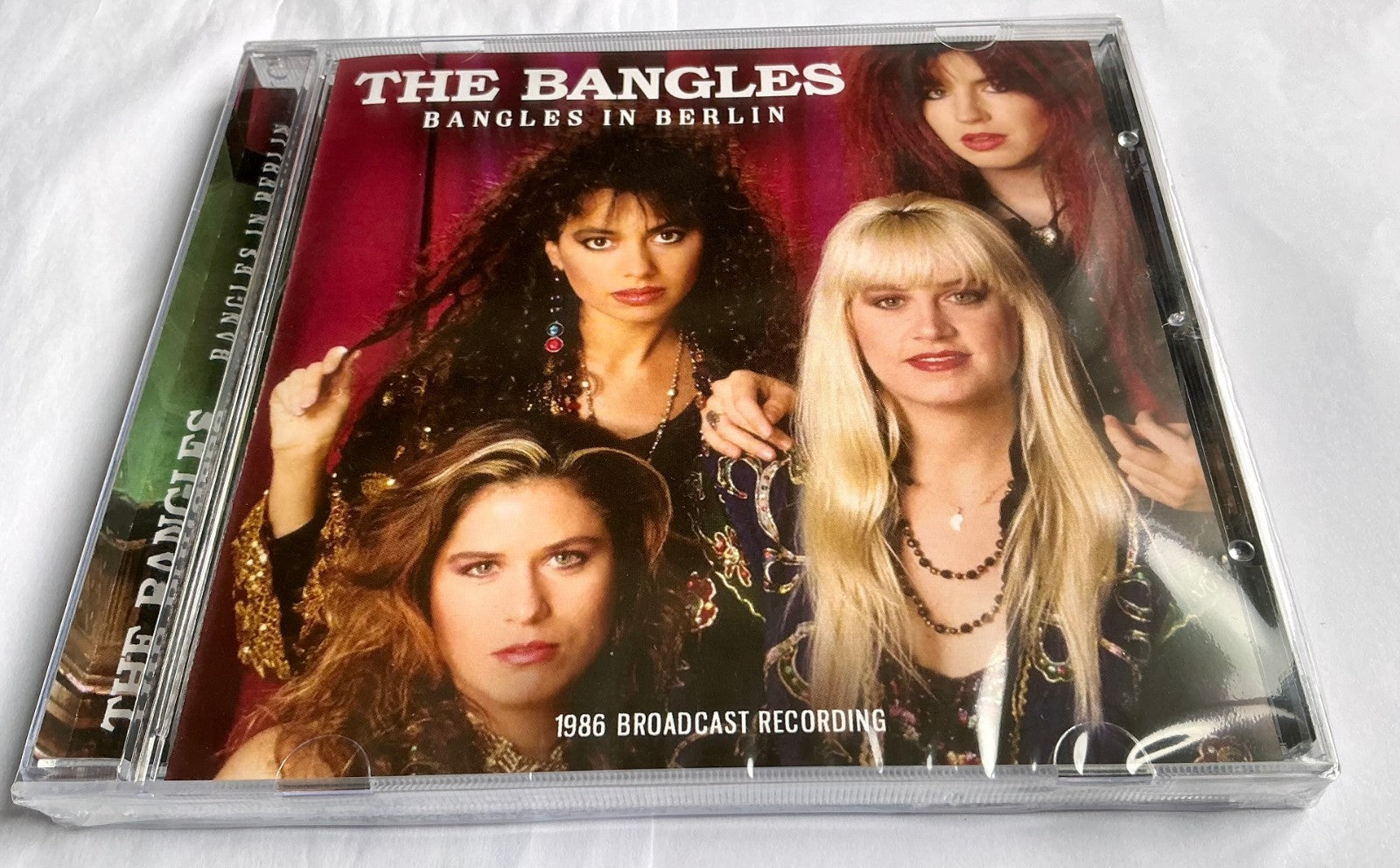 CD case for The Bangles’ “Bangles In Berlin” featuring three band members.