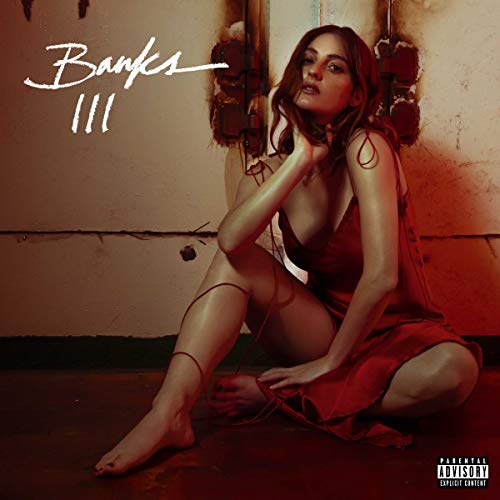 Album cover for Banks’ “III” featuring a woman in a red dress.