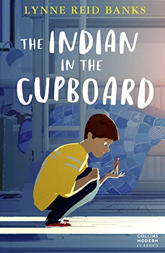 Book cover: boy looking at a small figure in his hand.