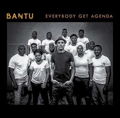 "Black and white album cover featuring a group of people standing together."