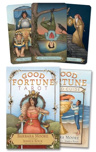 Tarot card deck and guidebook with ornate illustrations and gold lettering.