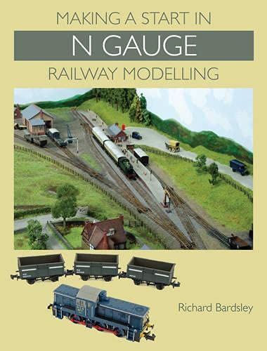 Book cover showing an N gauge model railway layout with a train and wagons.