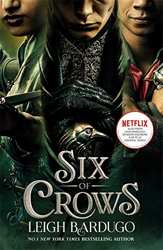 Book cover for “Six of Crows” featuring three shadowed figures and a raven.