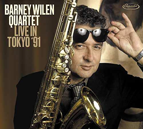 Man holding a saxophone, wearing sunglasses, with album title text on the left.