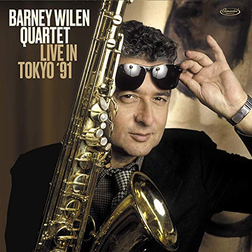 "Album cover featuring a man holding a saxophone and wearing sunglasses."