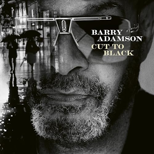 Black and white album cover featuring a man in sunglasses and beard.