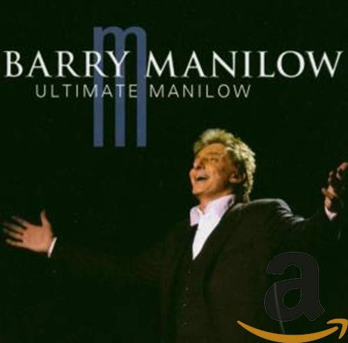 Barry Manilow album cover featuring the artist in performance.