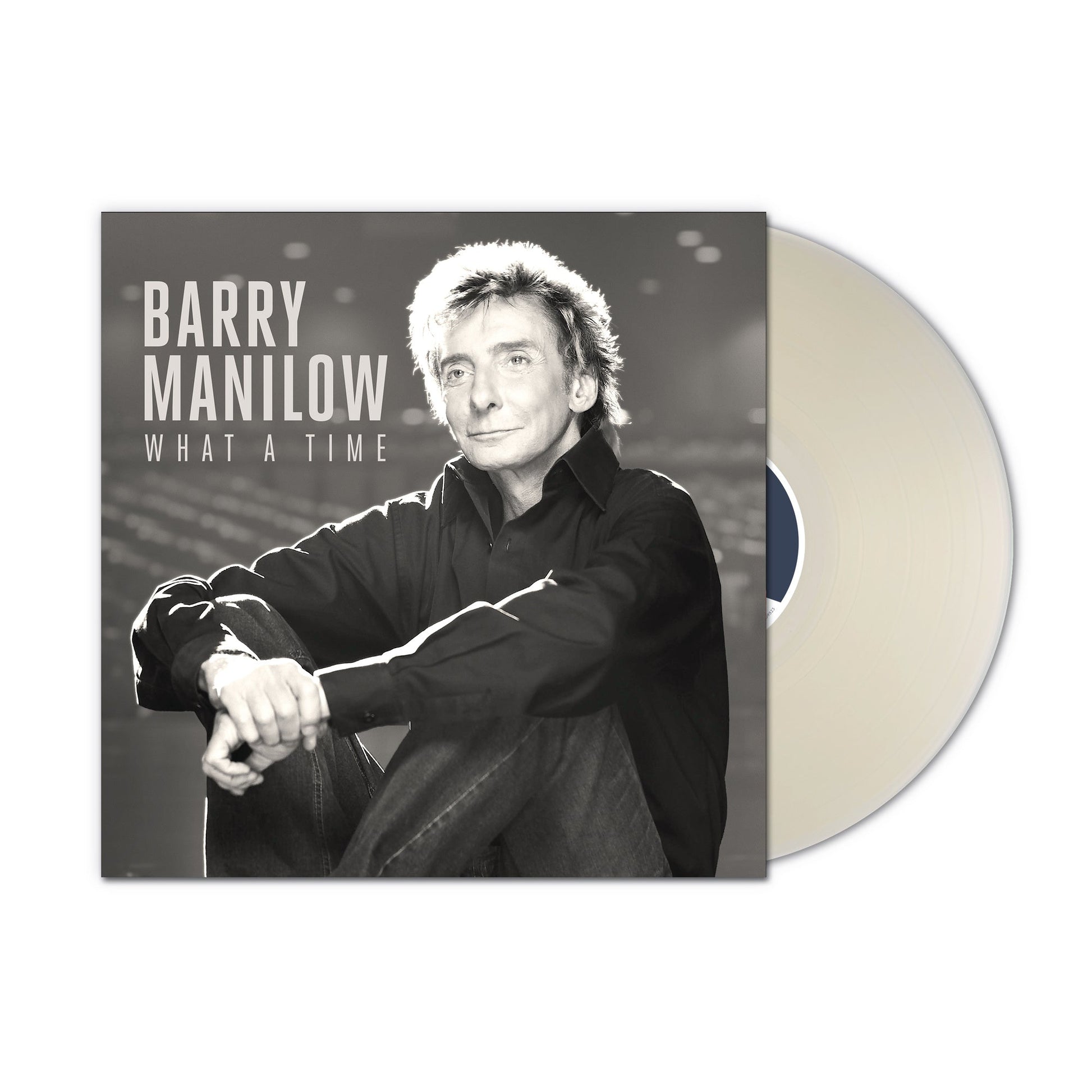 Barry Manilow album cover with a milky clear vinyl record beside it.