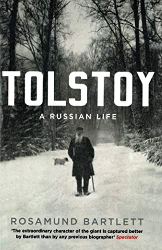 Book cover featuring a man and dog in a snowy forest with title TOLSTOY.