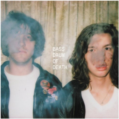 Vinyl album cover featuring two people with obscured faces and long hair.